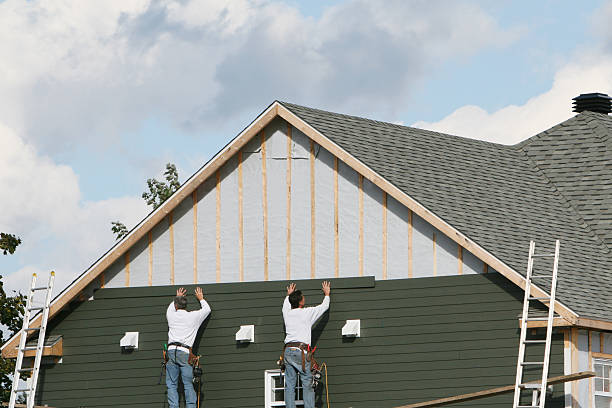 Professional Storm Damage Siding Repair technician working in Jacksonville, IL
